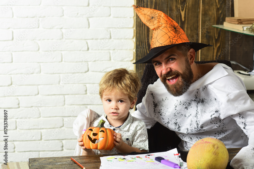 Fototapeta premium Man in orange hat and kid with happy, interested faces