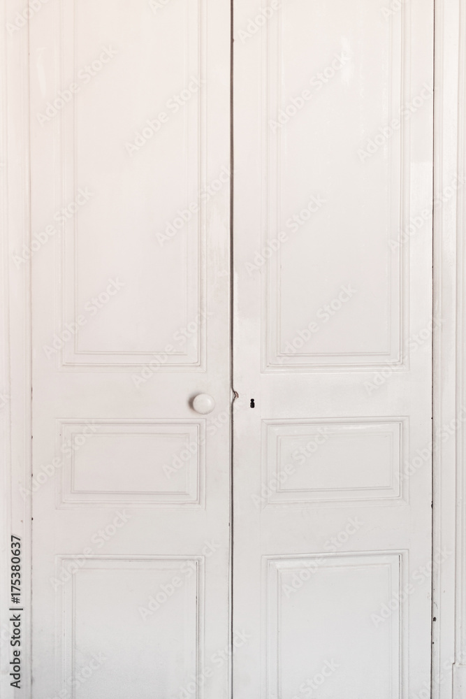 Fototapeta premium White Old classic door. Antique dirty door in a room, closed.