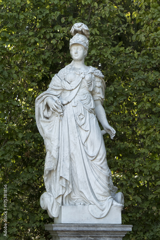 Marble figure of a Greek warrior against the backdrop of a scrub forest Marble figure of a Greek warrior against the backdrop of a scrub forest