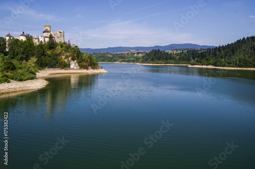 Niedzica Castle - Dunajec Castle - in the Pieniny mountains on a bright summer day / Poland 