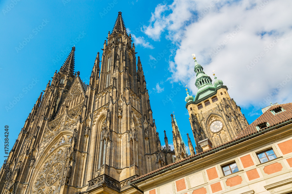 Obraz premium Closeup view on gothic cathedral of St. Vitus with blue sky in Prague Castle, Prague, Czech Republic
