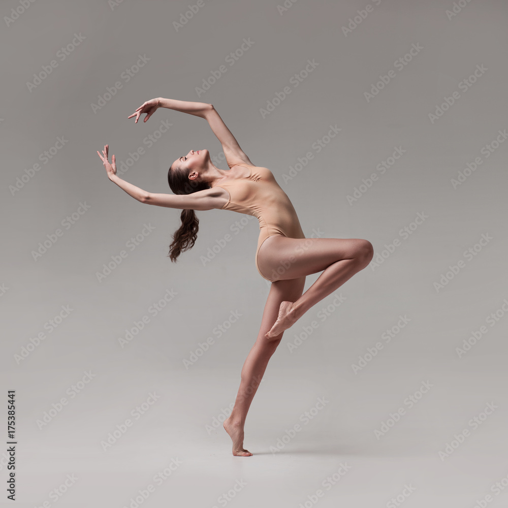 young beautiful ballet dancer in beige swimsuit - obrazy, fototapety, plakaty 