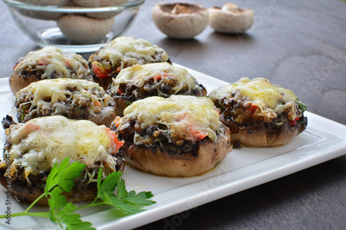 Stuffed mushrooms with cheese, bacon and vegetables