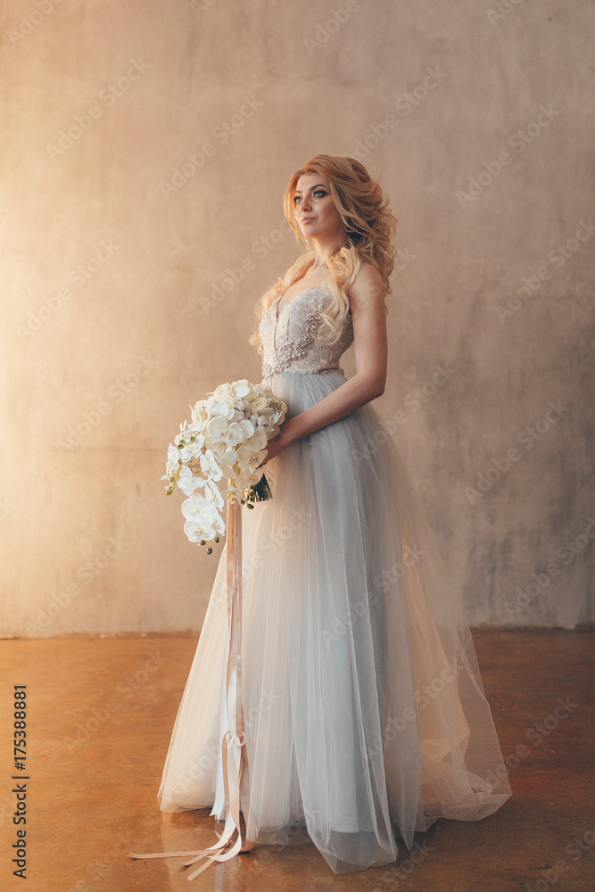 wedding in European style, beautiful couple in the Studio with a small dog wedding in European style, beautiful couple in the Studio with a small dog