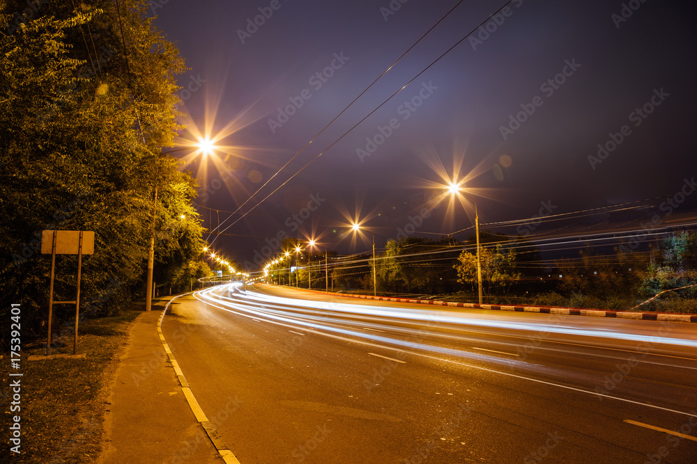 Traffic light trails on the turning road at Voronezh street