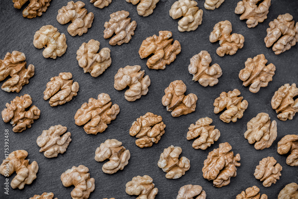 Walnut background overhead group lined up on black stone in studio