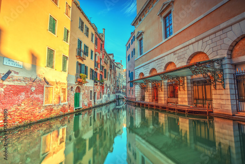 Fototapeta Naklejka Na Ścianę i Meble -  Historical streets in water canal filled with green water, Venice, Italy