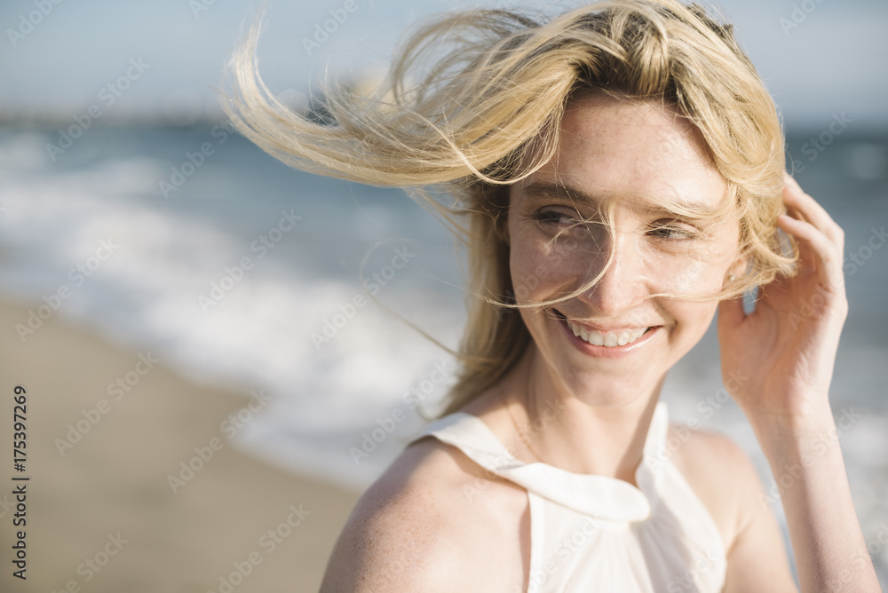Happy blonde woman portrait on the beach Happy blonde woman portrait on the beach