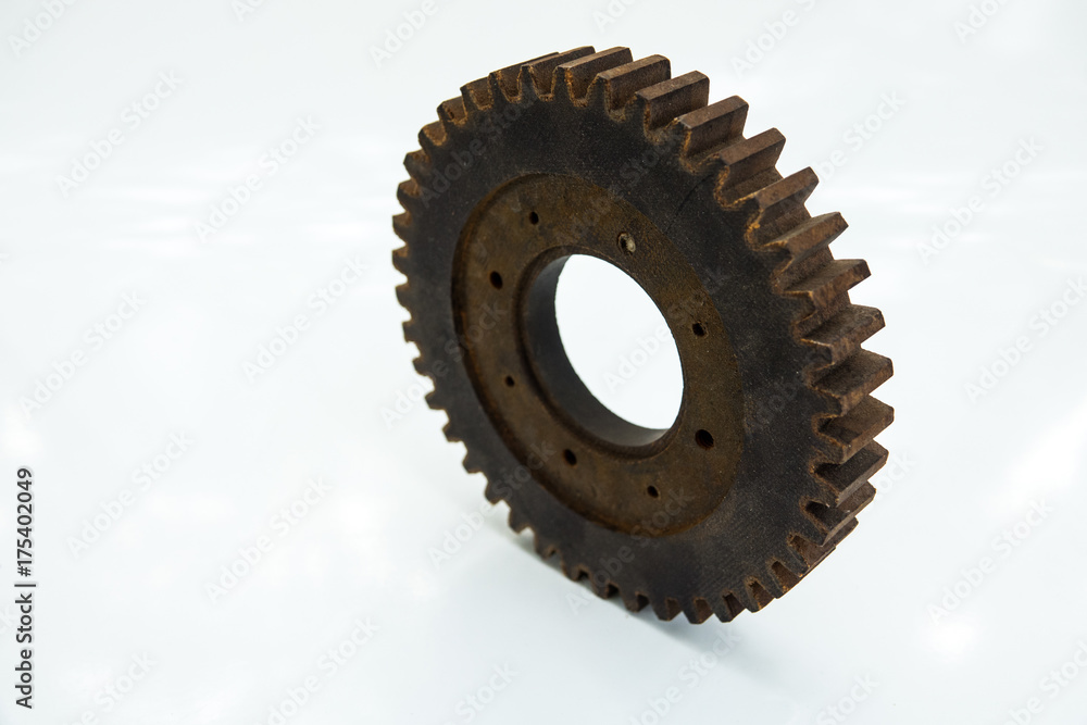 Wooden toothed wheels. The concept of creative and logical thinking. Start, process, result. on a white isolated background, selective focus Wooden toothed wheels. The concept of creative and logical thinking. Start, process, result. on a white isolated background, selective focus