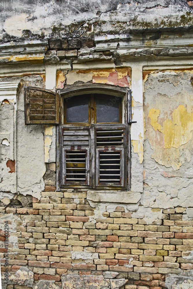 Old devastated house and window
