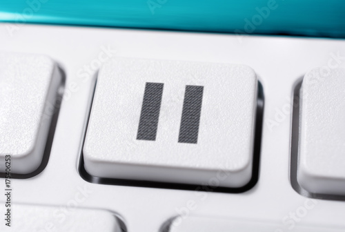 Close Up Of A White Pause Button Of A White Remote Control For A Hifi Stereo Audio System photo