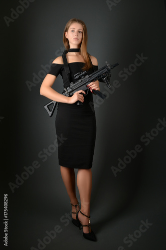 beautiful sexy girl holding gun
