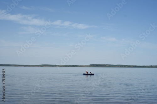 Two Kids on Boat on a Lake