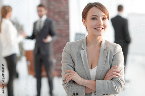 portrait of confident business woman on the background of the office. Free Download portrait of confident business woman on the background of the office. - GFXLoad