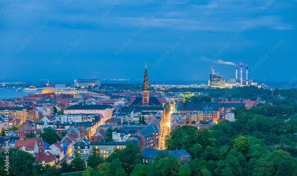 Unique cityscape of Copenhagen, skyline of industrial and habitated zone in the evening