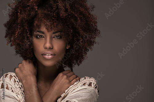 Beautiful woman with afro hairstyle posing.