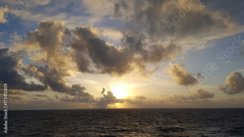 Landscape View of Sunrise or Sunset On the Blue Pacific Ocean With Clouds and Sun