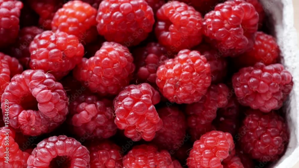 Fresh raspberry fruits in paper box. Healthy food organic nutrition. View from above. Dolly slider shot 4K ProRes HQ codec Fresh raspberry fruits in paper box. Healthy food organic nutrition. View from above. Dolly slider shot 4K ProRes HQ codec