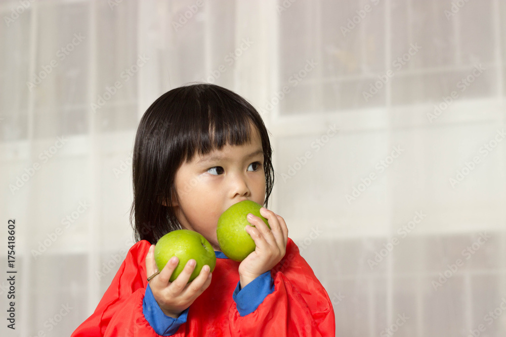 child girl eating and apples.. child girl eating and apples..