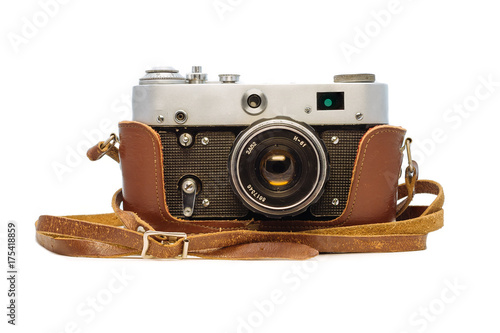 Analog soviet camera FED in the leather case isolated on white background. Old dusty retro film photographic equipment .