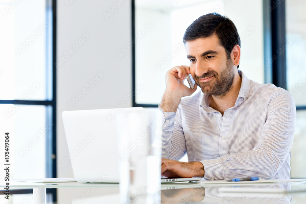 Confident young man in smart casual wear holding phone Confident young man in smart casual wear holding phone