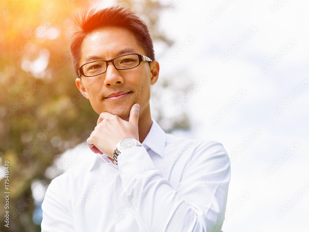Young happy and successful businessman during his break in park Young happy and successful businessman during his break in park