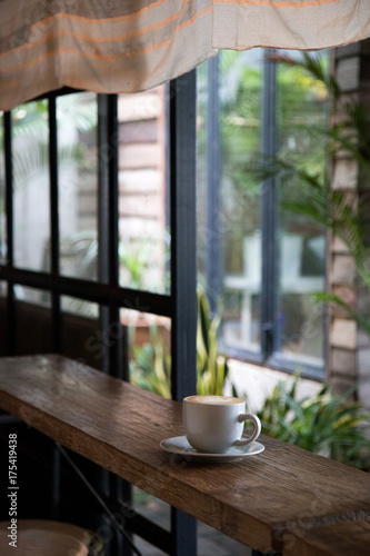 A cup of coffee at the cafe interior.