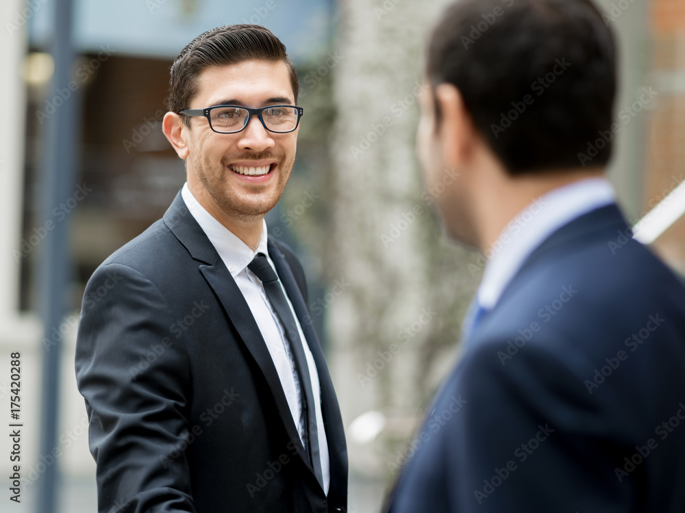 Two businessmen shaking their hands Two businessmen shaking their hands