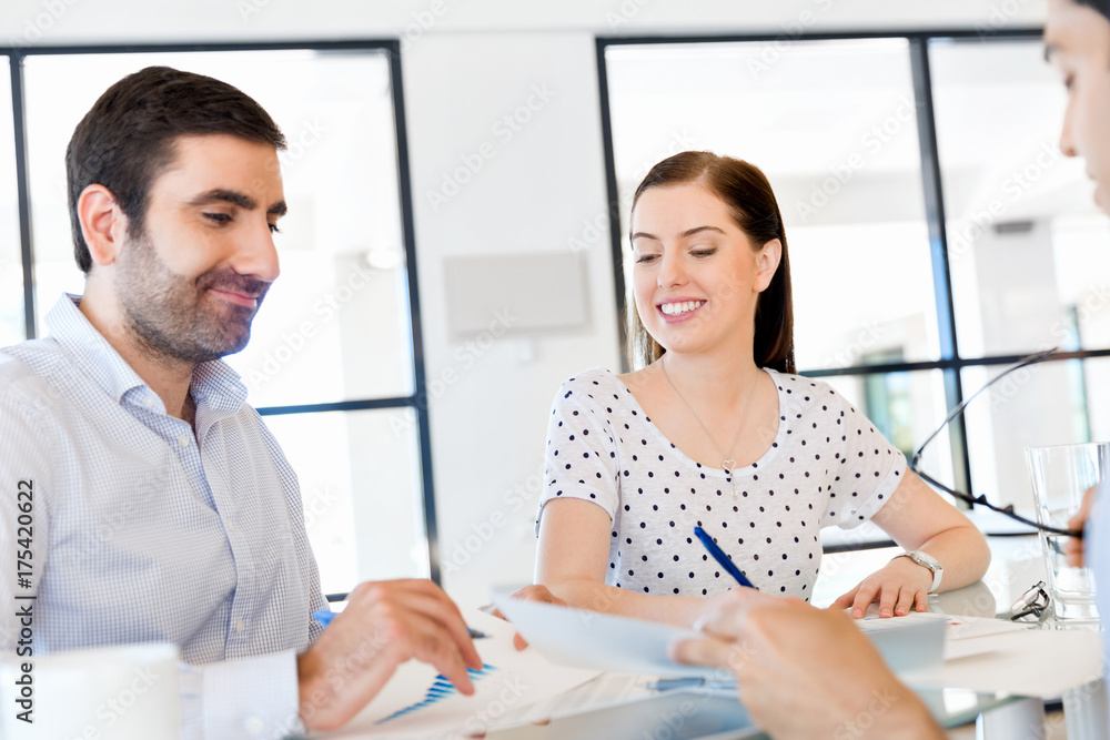 Fototapeta premium Group of happy young business people in a meeting