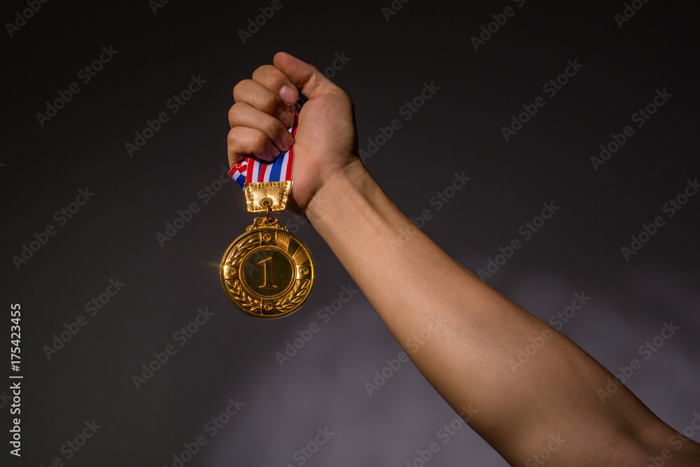 Winner holding number one golden coin