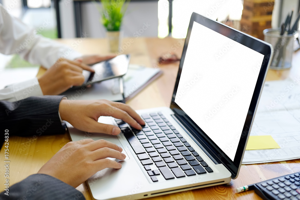 Business people are working documents and using laptop while co-working in the office Business people are working documents and using laptop while co-working in the office