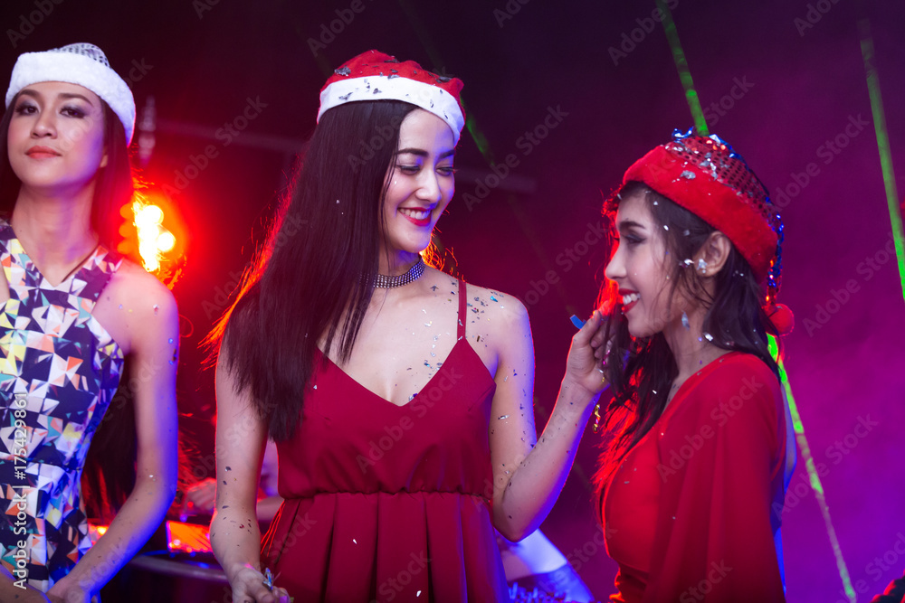 Group of young Asian Women Dancing Together in Nightcub. Woman Dancing with Attractives Smiling. People with Party Concept. Group of young Asian Women Dancing Together in Nightcub. Woman Dancing with Attractives Smiling. People with Party Concept.