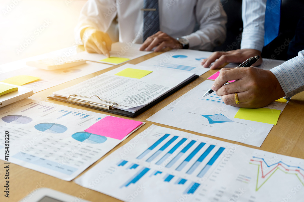 Two businessman working  with graph chart