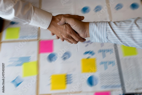 Businessman hand together Handshake for business project photo