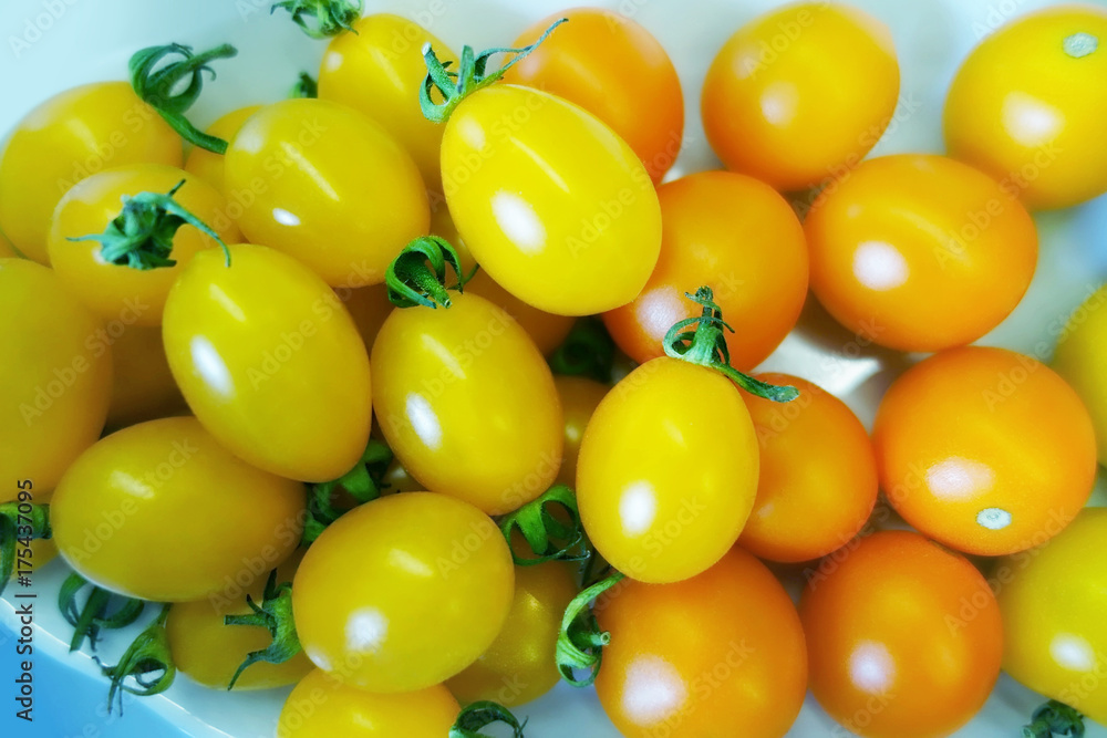 Yellow and orange cherry tomatoes Yellow and orange cherry tomatoes