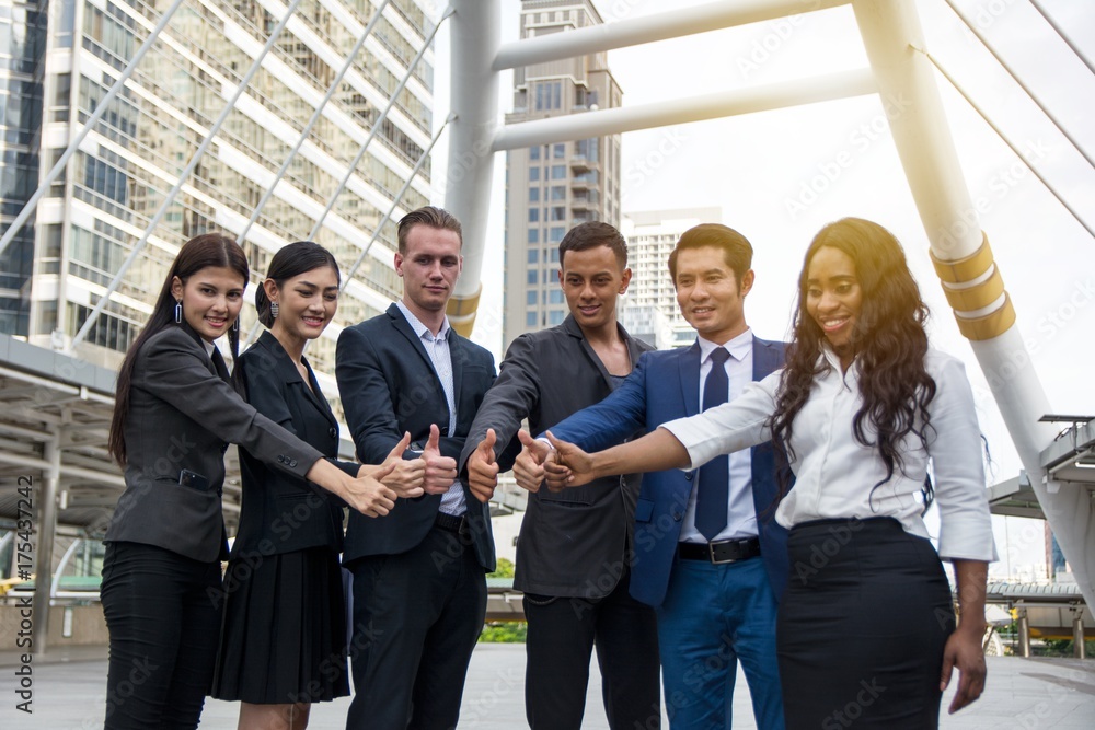 Smile businessmen showing thumb with confidence Smile businessmen showing thumb with confidence