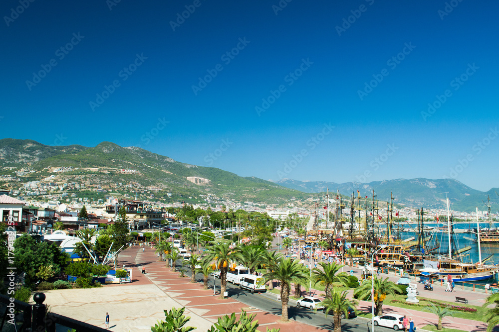 Port of Alanya. Alanya is a beach resort city and a component district of Antalya Province on the southern coast of Turkey