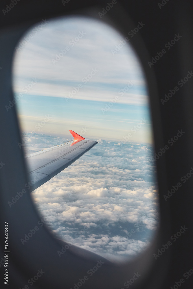 Clouds. sky with clouds and airplane swing at sunset or sunrise. sunset with a height of 10 000 km. Top view from the airplane window Clouds. sky with clouds and airplane swing at sunset or sunrise. sunset with a height of 10 000 km. Top view from the airplane window