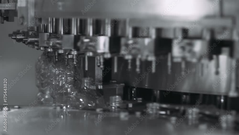 Production line of drinking mineral water and carbonated drinks, plastic bottles moving along a conveyor.
Production line of drinking mineral water and carbonated drinks, plastic bottles moving along a conveyor.