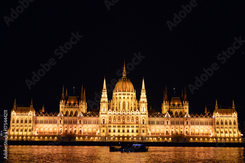 Hungarian Parliament at night with a boat