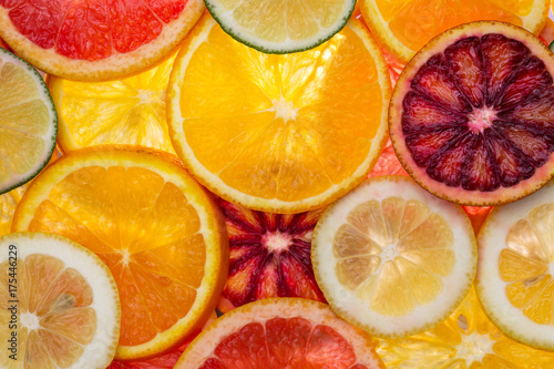 sliced mixed citrus fruits, close-up