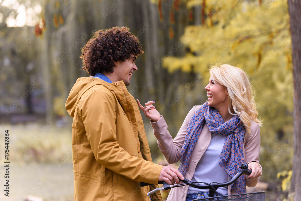 Fototapeta premium Young love couple walking in autumn park