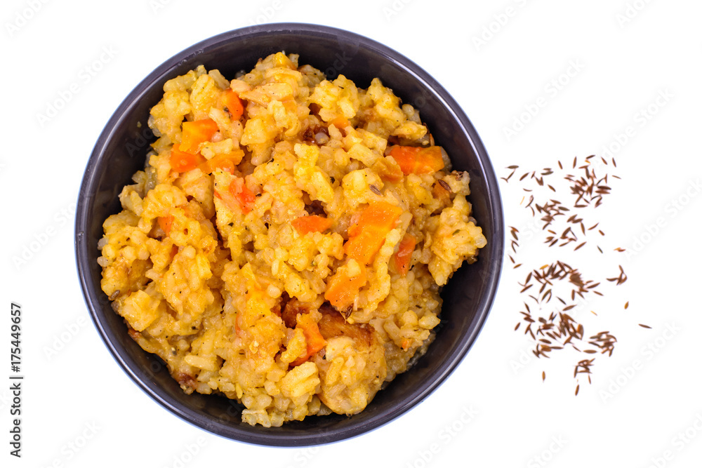 Rice with vegetables in black bowl on white background. View from above Rice with vegetables in black bowl on white background. View from above