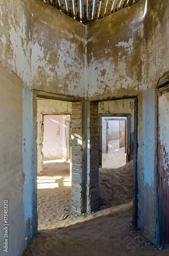 Ruins of once prosperous German mining town Kolmanskop in the Namib desert near Luderitz, Namibia, Southern Africa