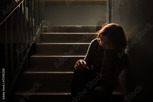 Fotografie woman in  sweater at the steps, dark style