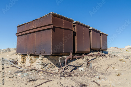 Ruins of once prosperous German mining town Kolmanskop in the Namib desert near Luderitz, Namibia, Southern Africa photo