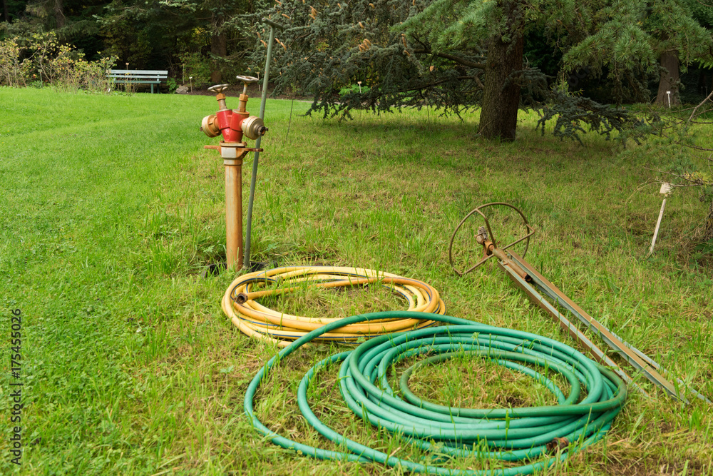 watering hose and hydrant in the garden