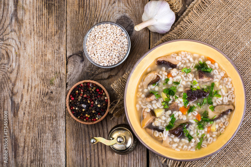 Soup with pearl barley and forest mushrooms