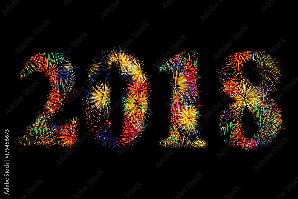 Digits 2018 made of colorful fireworks on black background. New Year 2018 concept.