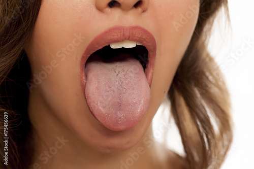 young beautiful woman stick out her tongue